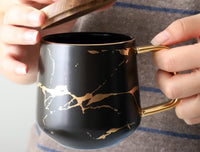 hand holding Ceramic coffee mug